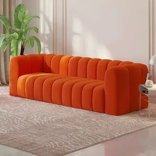 Orange channel-tufted three-seater sofa