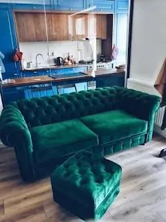 Emerald green sofa with matching ottoman