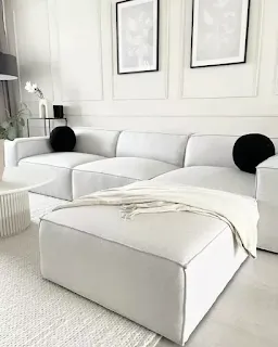 White modular sectional with ottoman